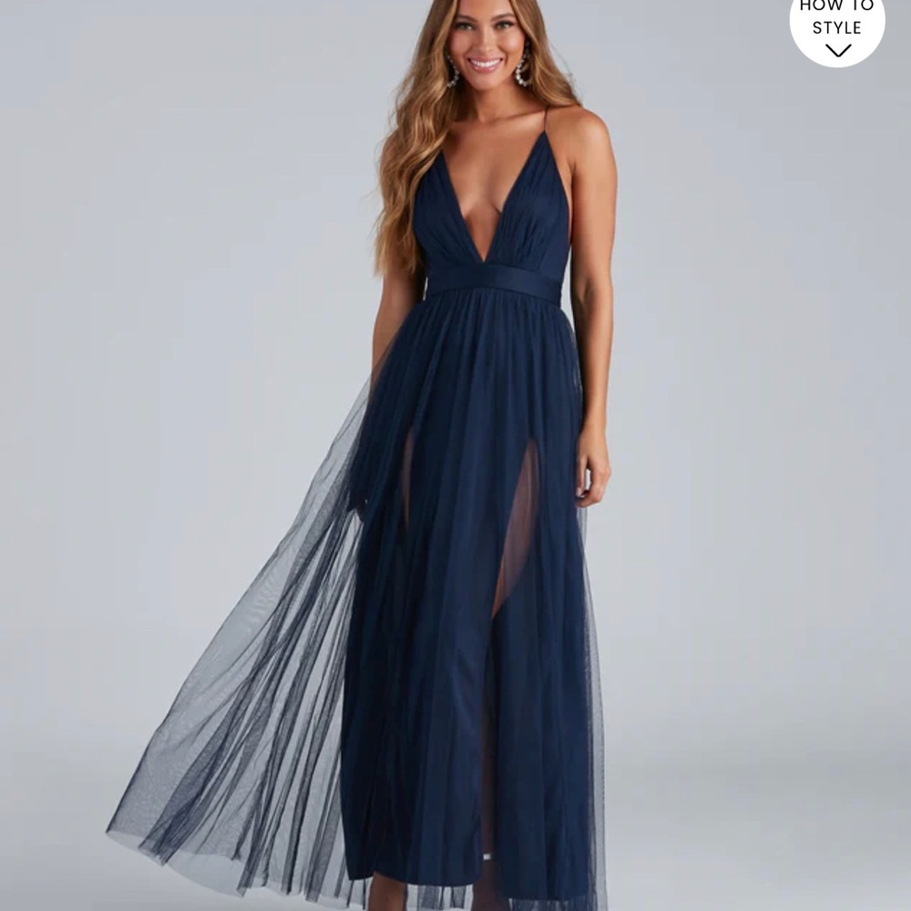 Long, v neck navy blue dress.